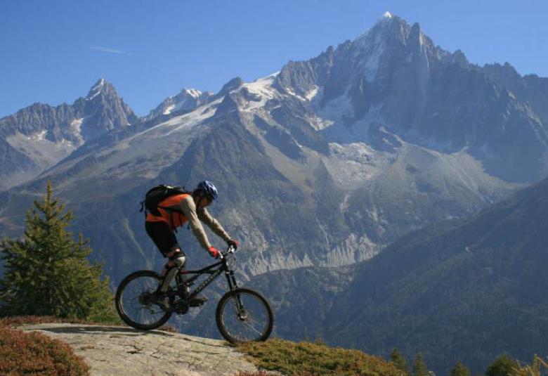 Mountain Biking in Chamonix facing Mont Blanc and the Drus
