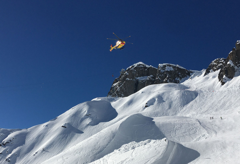 Civil security helicopter on mission over the Brevent ski area in Chamonix