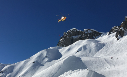 Civil security helicopter on mission over the Brevent ski area in Chamonix